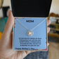 MOM, THE BOND BETWEEN US IS UNBREAKABLE JUST LIKE THIS KNOT/ LOVE KNOT NECKLACE W/ON DEMAND MESSAGE CARD